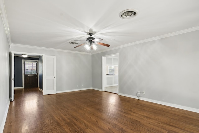 empty room featuring ornamental molding, dark hardwood / wood-style floors, and ceiling fan