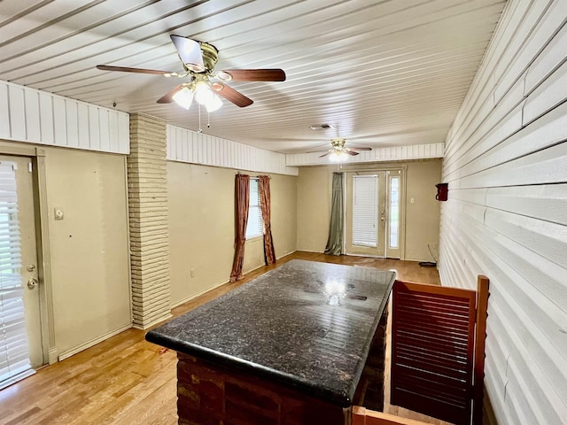 interior space with ceiling fan and light hardwood / wood-style flooring