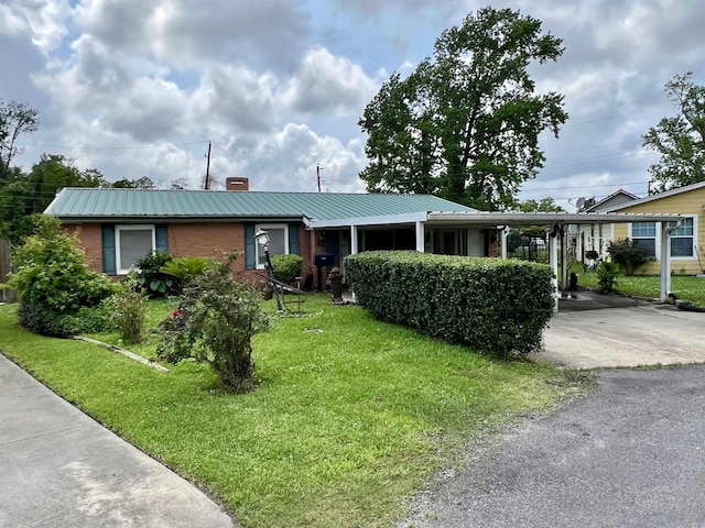 ranch-style home with a front lawn and a carport