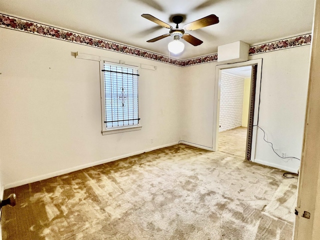 empty room with carpet floors and ceiling fan