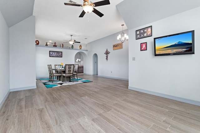 200 Skylark Ave, Bridge City, TX 77611 - interior space with arched walkways, a ceiling fan, light wood-type flooring, a chandelier, and lofted ceiling