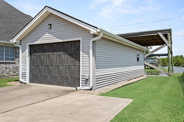 200 Skylark Ave, Bridge City, TX 77611 - garage featuring a water view and concrete driveway