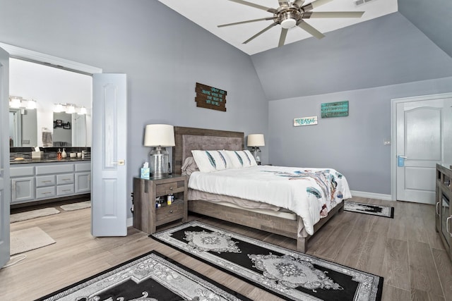 200 Skylark Ave, Bridge City, TX 77611 - bedroom with vaulted ceiling, light wood finished floors, connected bathroom, and ceiling fan