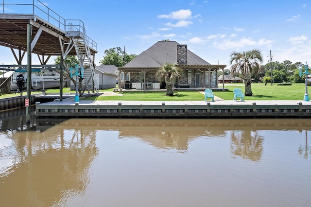 200 Skylark Ave, Bridge City, TX 77611 - dock featuring a water view and a lawn