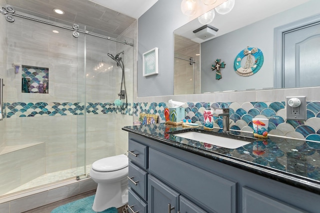 200 Skylark Ave, Bridge City, TX 77611 - bathroom with vanity, a shower stall, backsplash, and tile walls