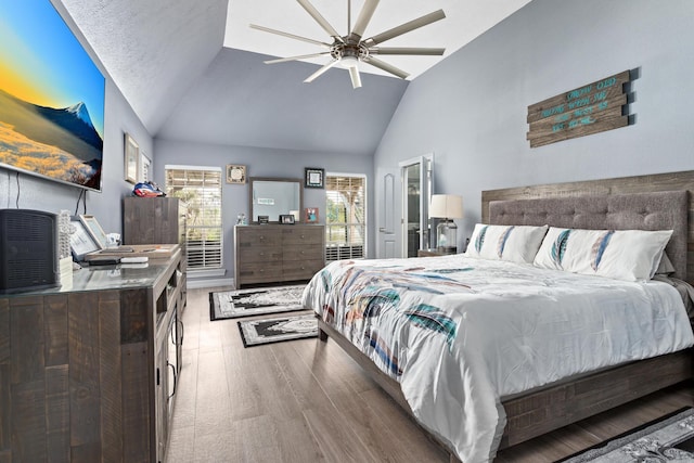 200 Skylark Ave, Bridge City, TX 77611 - bedroom featuring wood finished floors, multiple windows, high vaulted ceiling, and a ceiling fan