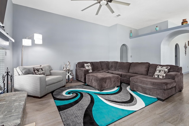 200 Skylark Ave, Bridge City, TX 77611 - living area with arched walkways, ceiling fan, and wood finished floors