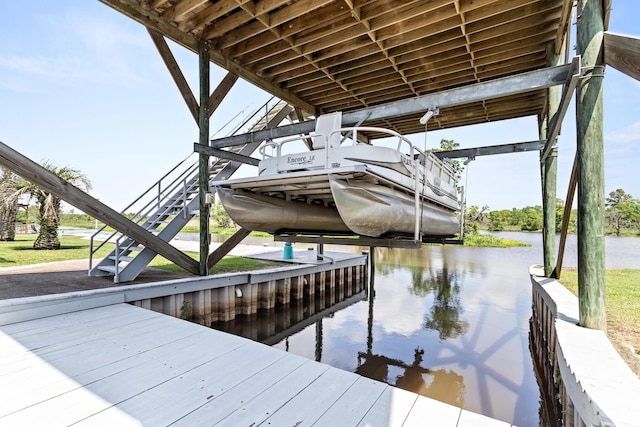 200 Skylark Ave, Bridge City, TX 77611 - dock featuring a water view and boat lift