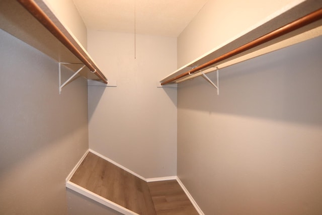 8720 Glen Mdw, Beaumont, TX 77706 - walk in closet featuring wood finished floors