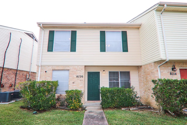 8720 Glen Mdw, Beaumont, TX 77706 - multi unit property with brick siding, central AC, and a front yard
