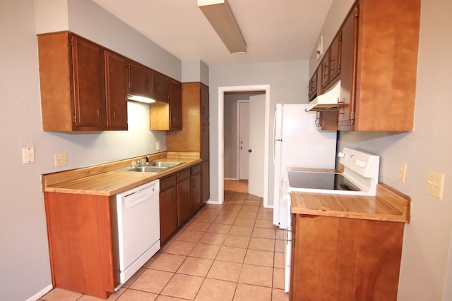 8720 Glen Mdw, Beaumont, TX 77706 - kitchen with white appliances, a sink, under cabinet range hood, and light countertops