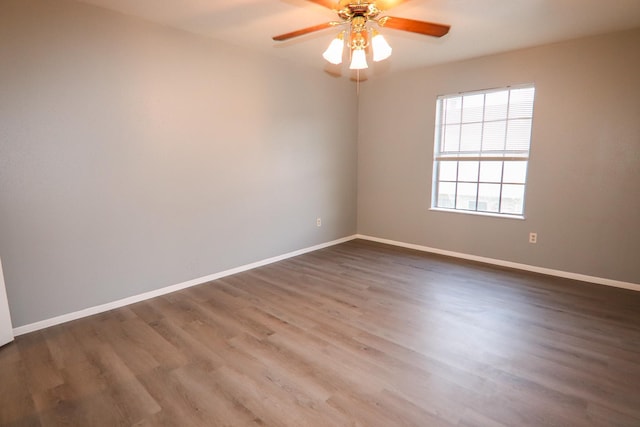 8720 Glen Mdw, Beaumont, TX 77706 - empty room featuring dark wood-style floors, baseboards, and ceiling fan