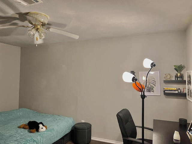 bedroom with hardwood / wood-style flooring and ceiling fan