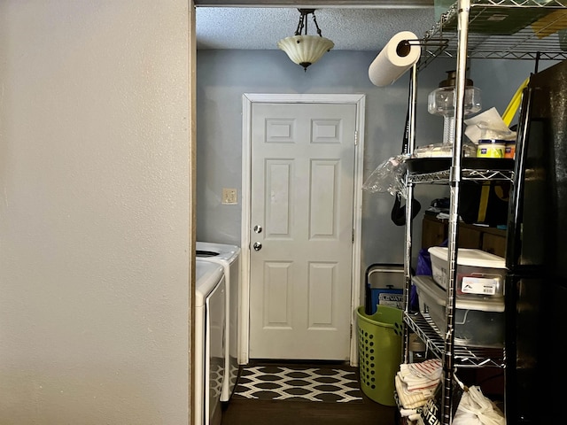 interior space featuring a textured ceiling and washer and clothes dryer