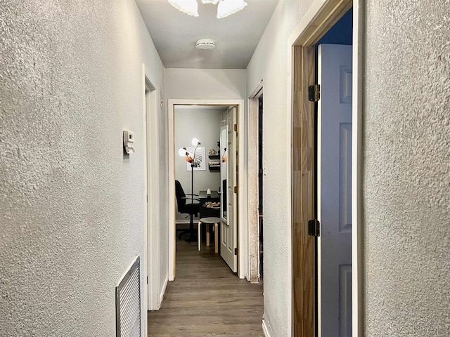 hallway featuring hardwood / wood-style floors