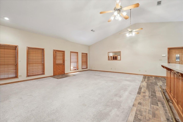 7385 Fannett Rd, Beaumont, TX 77705 - unfurnished living room with baseboards, a ceiling fan, and high vaulted ceiling