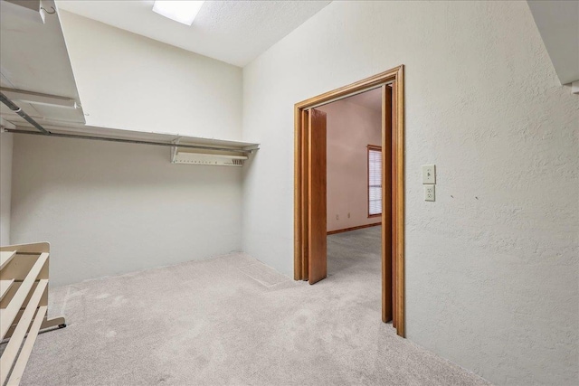 7385 Fannett Rd, Beaumont, TX 77705 - walk in closet featuring carpet floors and vaulted ceiling