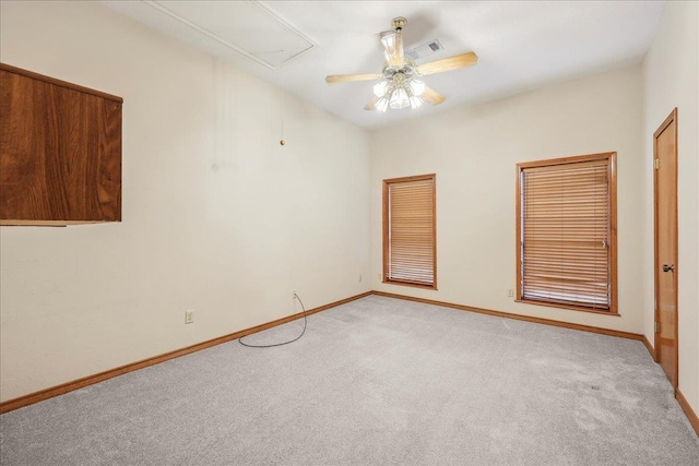 7385 Fannett Rd, Beaumont, TX 77705 - unfurnished room featuring light colored carpet, attic access, baseboards, and ceiling fan