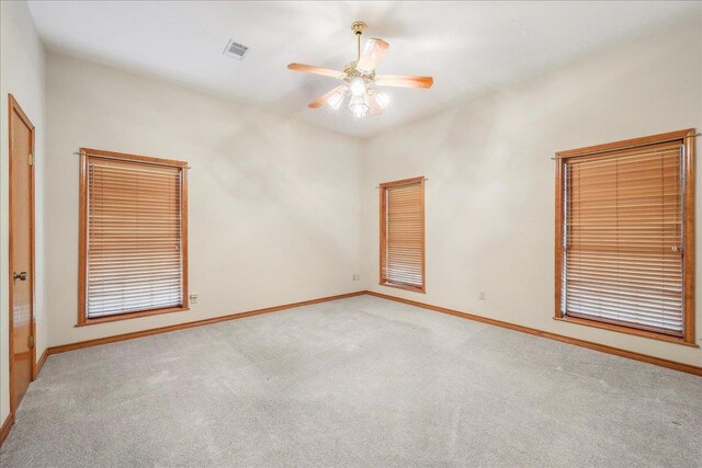 7385 Fannett Rd, Beaumont, TX 77705 - carpeted empty room featuring ceiling fan and baseboards