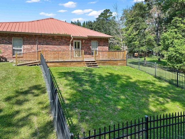 view of yard with a wooden deck