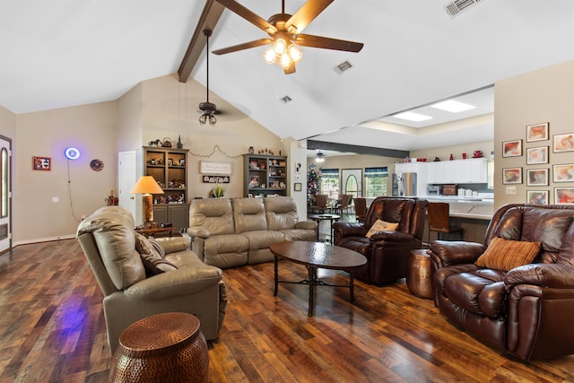 living room with vaulted ceiling with beams, ceiling fan, and dark wood-type flooring