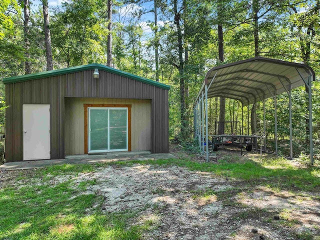 view of outbuilding featuring a carport