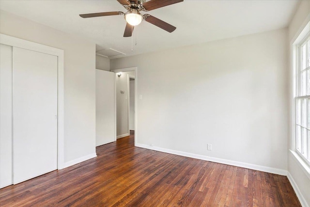 unfurnished bedroom featuring ceiling fan, a closet, and dark hardwood / wood-style floors