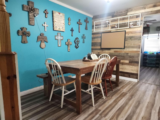 966 W Fm 1013, Kirbyville, TX 75956 - dining room with baseboards, wood walls, ornamental molding, and wood finished floors