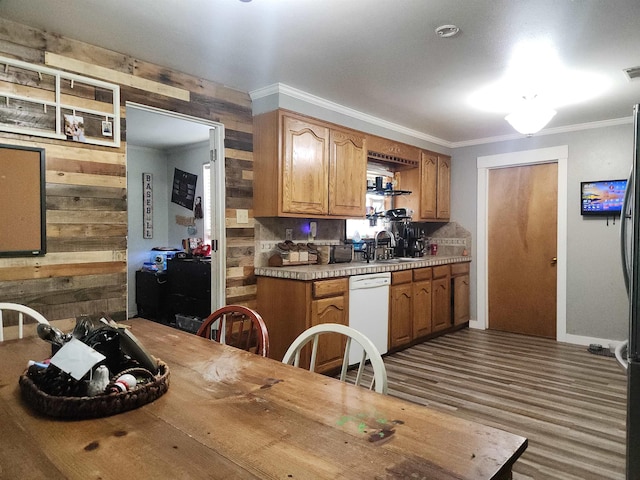 966 W Fm 1013, Kirbyville, TX 75956 - kitchen featuring dishwasher, wooden walls, ornamental molding, light countertops, and a sink