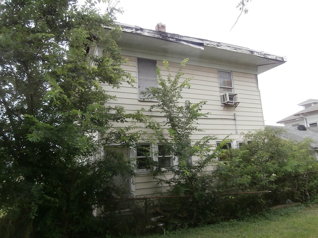 view of home's exterior with cooling unit