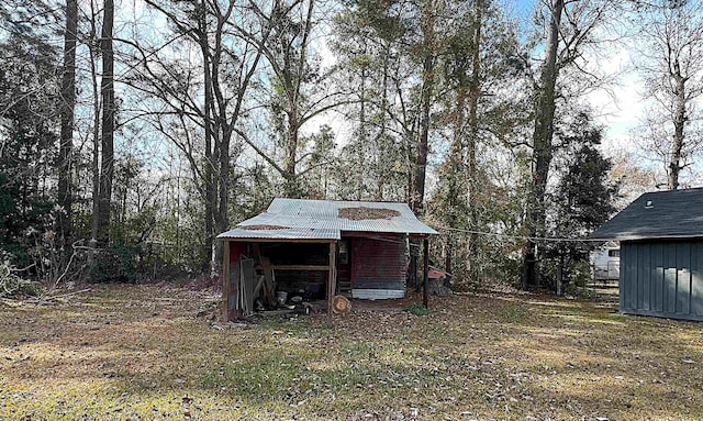 view of outdoor structure with a lawn