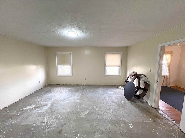 spare room with a textured ceiling