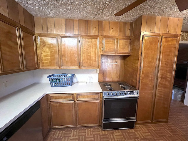 kitchen featuring light parquet floors, dishwasher, wooden walls, and electric stove