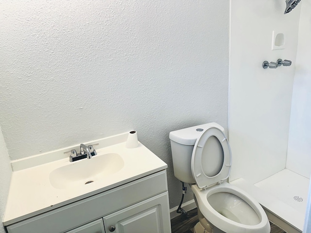 9130 Doty St, Beaumont, TX 77707 - full bath with toilet, vanity, a shower stall, and baseboards