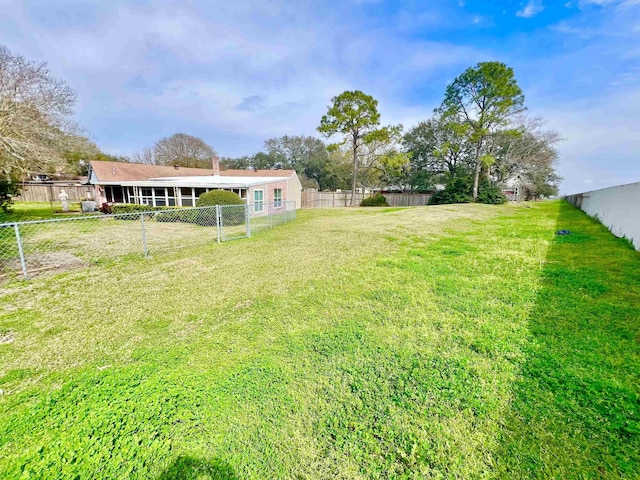 view of yard featuring a fenced backyard