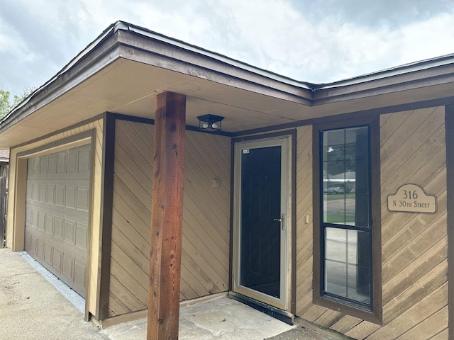 property entrance with a garage