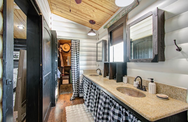 bathroom featuring lofted ceiling, wood-type flooring, wooden ceiling, and vanity