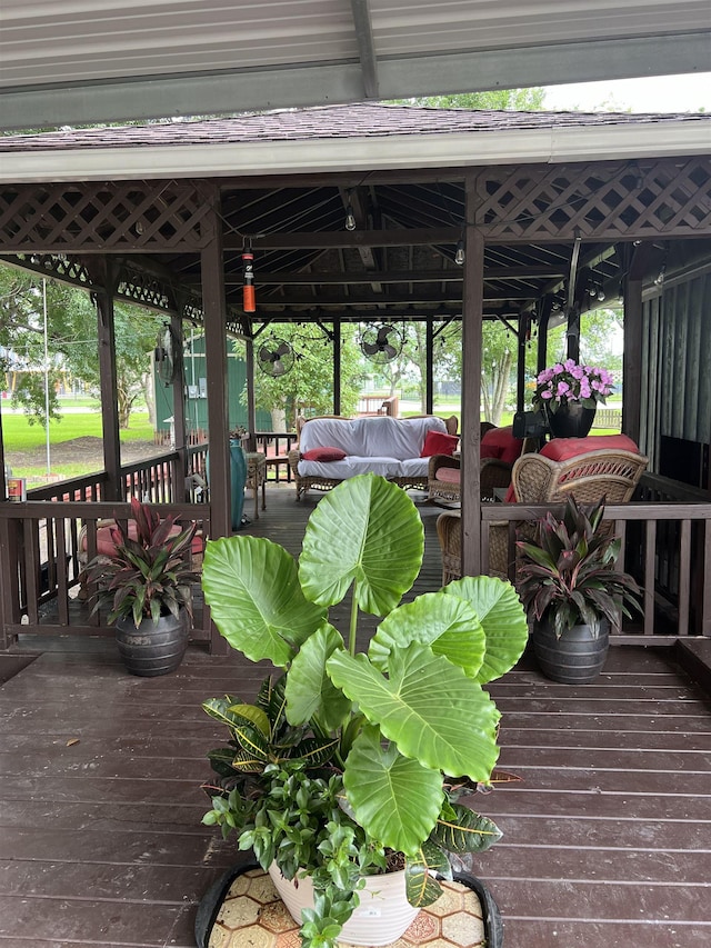 deck with outdoor lounge area and a gazebo