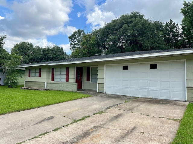 401 Camellia Ave, Orange, TX 77630 - ranch-style home featuring concrete driveway, a front lawn, and an attached garage