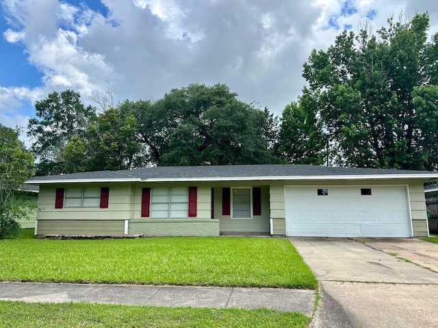 401 Camellia Ave, Orange, TX 77630 - ranch-style home with a garage, driveway, and a front lawn
