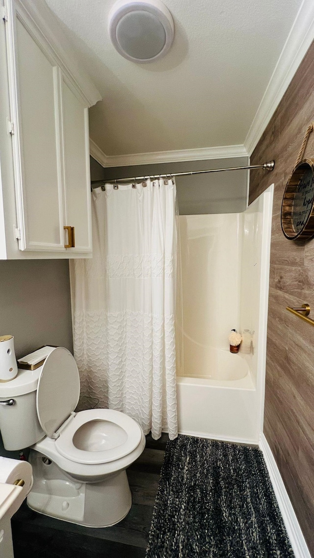 bathroom with shower / bath combination with curtain, wooden walls, toilet, ornamental molding, and wood-type flooring