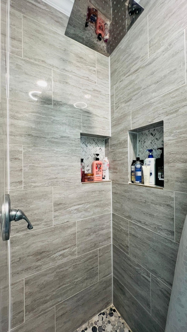 bathroom with tiled shower