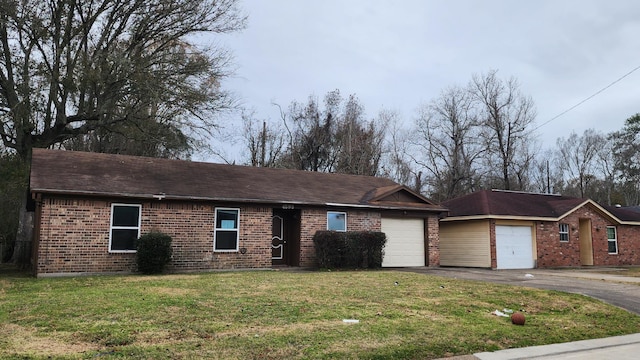 ranch-style house with a garage and a front lawn