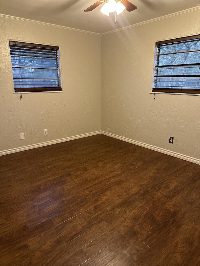 unfurnished room with dark hardwood / wood-style flooring, ceiling fan, and ornamental molding