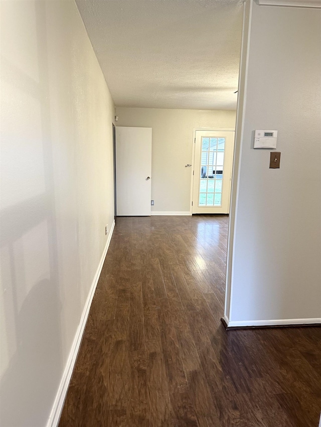 hallway featuring dark hardwood / wood-style floors