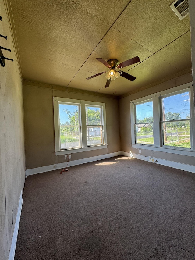 empty room with carpet and ceiling fan