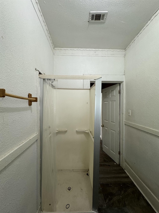 bathroom with a textured ceiling