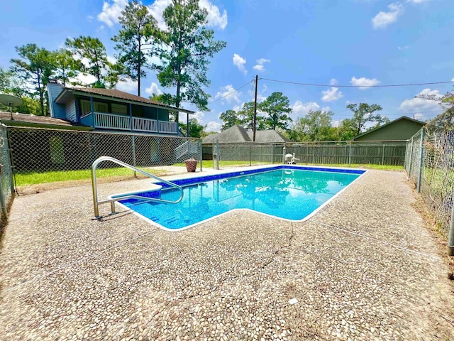 view of swimming pool featuring a patio