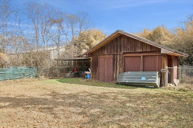 view of outdoor structure with a lawn