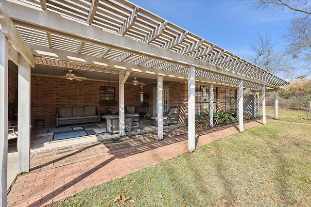 view of patio / terrace featuring an outdoor living space, ceiling fan, and a pergola